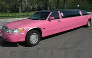 Front and side view of the Pink Lincoln Town Car in Madrid, Spain