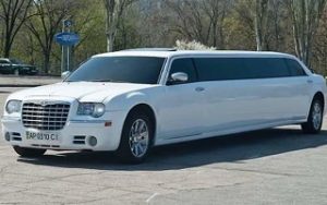 Front and side view of the white Chrysler Limousine in Lviv, Ukraine