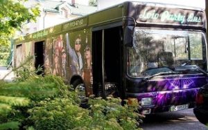 Front and side view of the black and purple Party Bus in Lviv, Ukraine